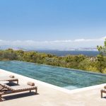 Infinity pool view and blossoming trees